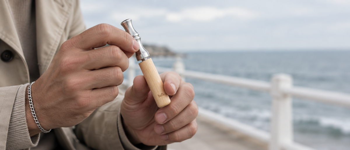 Hands twisting a maple Luft by the sea